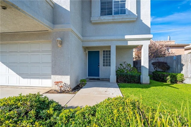 entrance to property with a yard