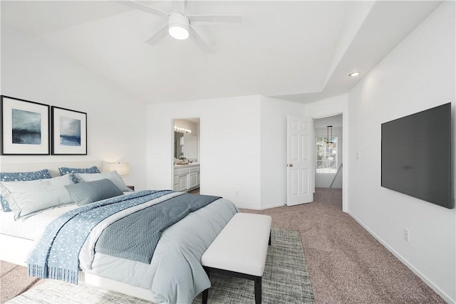 bedroom featuring carpet, ensuite bathroom, and ceiling fan