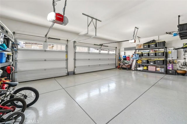 garage with a garage door opener and tankless water heater