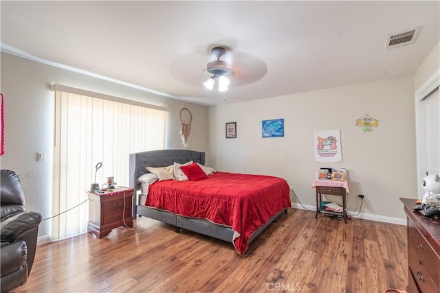 bedroom featuring hardwood / wood-style floors and ceiling fan