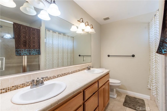 bathroom with decorative backsplash, tile patterned flooring, vanity, and toilet