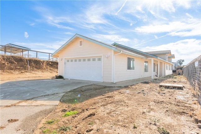 view of side of property featuring a garage