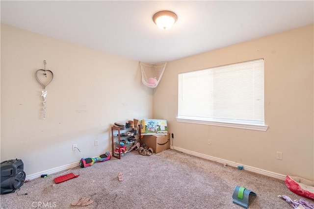 recreation room with carpet flooring