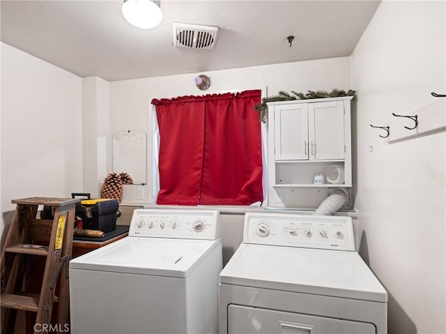 washroom with washer and dryer