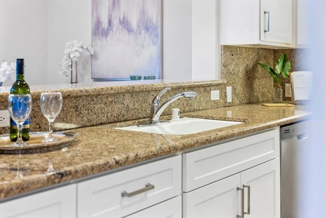 bathroom with tasteful backsplash and sink