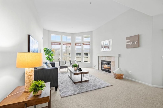 living room featuring a fireplace and carpet floors