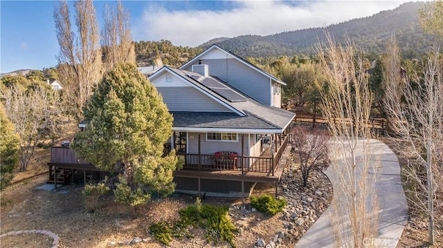 rear view of house with a mountain view