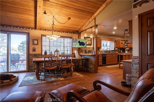 dining area featuring dark hardwood / wood-style flooring, vaulted ceiling with beams, wood ceiling, and plenty of natural light