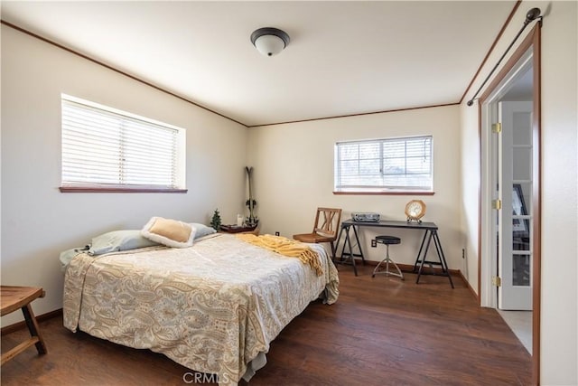 bedroom with dark hardwood / wood-style flooring