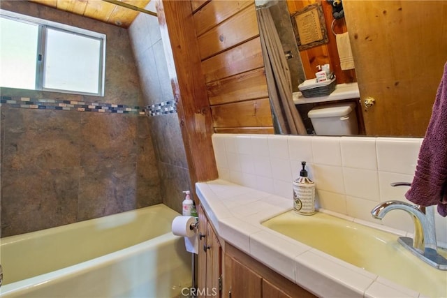 full bathroom with shower / tub combo, vanity, and toilet