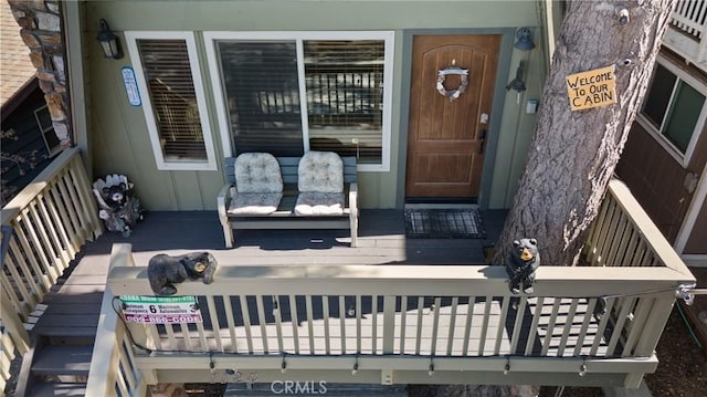 property entrance with covered porch