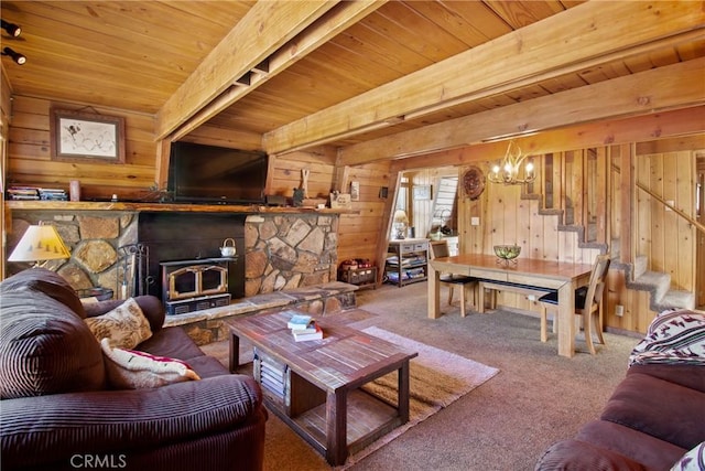 carpeted living room with a wood stove, wooden ceiling, an inviting chandelier, beamed ceiling, and wood walls