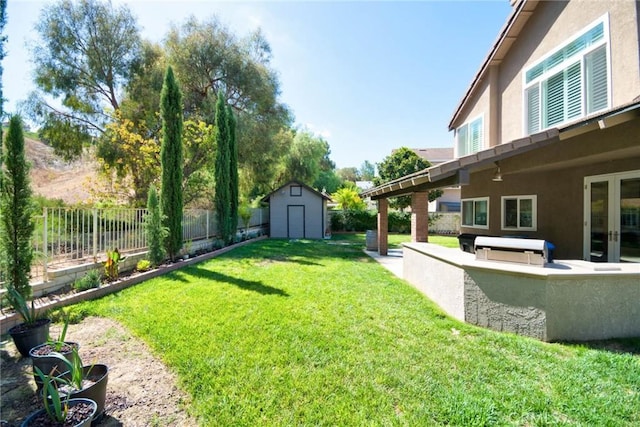 view of yard featuring a storage unit