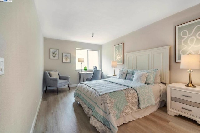 bedroom with light wood-type flooring