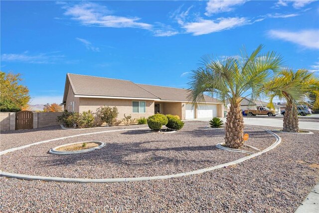 single story home with a garage