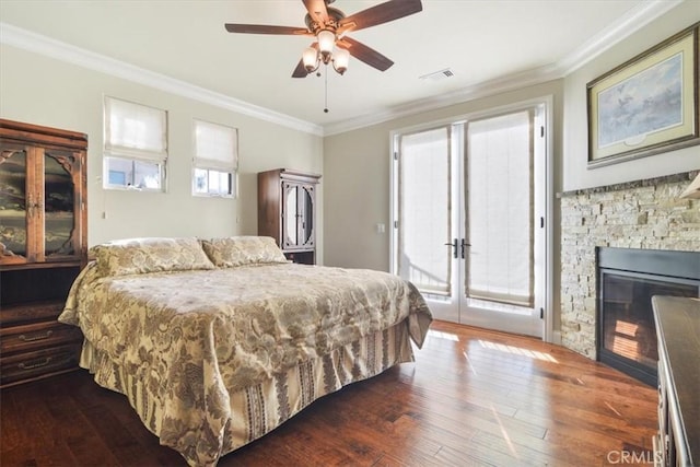 bedroom with multiple windows, access to outside, and ceiling fan