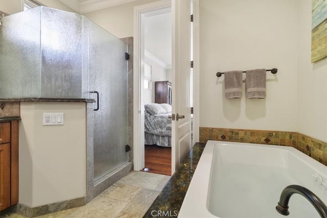 bathroom featuring ornamental molding, plus walk in shower, and vanity