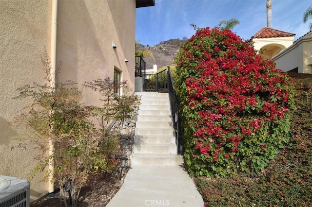 view of side of home featuring a mountain view