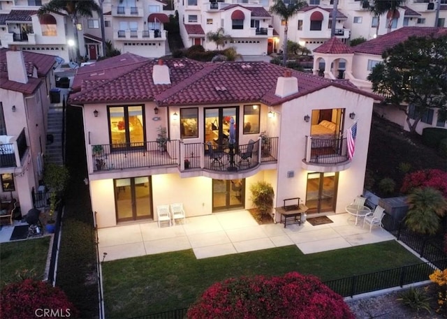 rear view of property featuring a patio