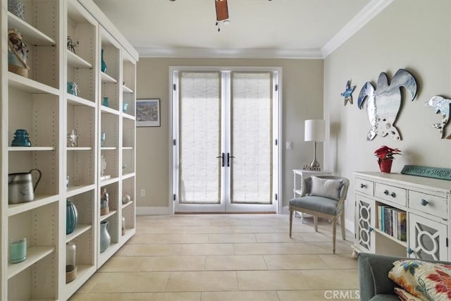 sitting room with light tile patterned floors, crown molding, french doors, and ceiling fan