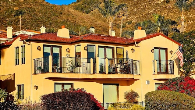 rear view of house with a balcony