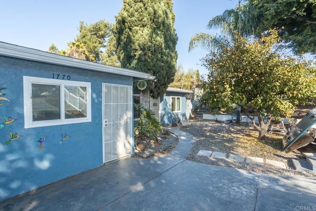 view of side of home featuring a patio area