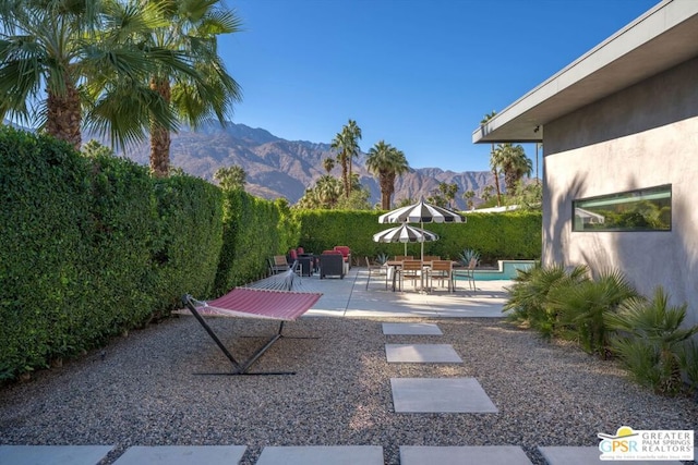 view of patio / terrace featuring a mountain view