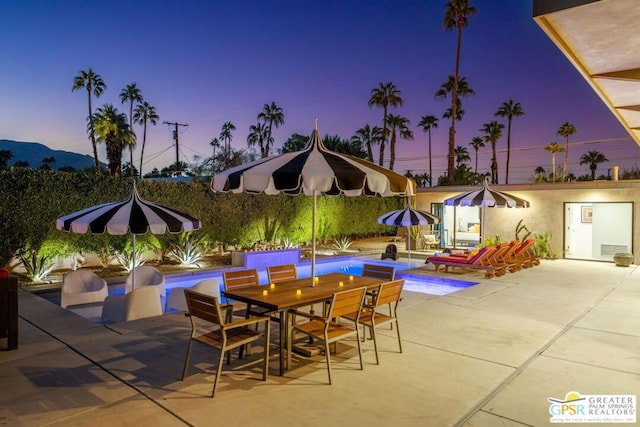 view of patio terrace at dusk