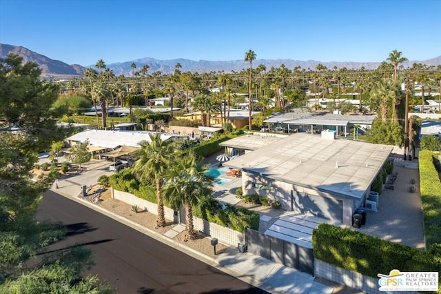 birds eye view of property with a mountain view