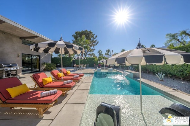 view of swimming pool with an outdoor hangout area, pool water feature, grilling area, and a patio area