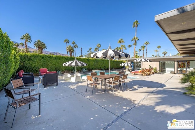 view of patio with a swimming pool