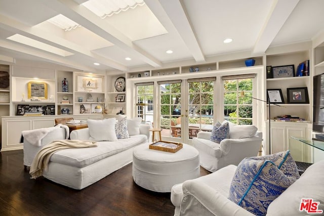 living room with beam ceiling, a wealth of natural light, and dark wood-type flooring