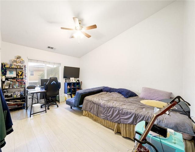 bedroom with ceiling fan and light hardwood / wood-style flooring