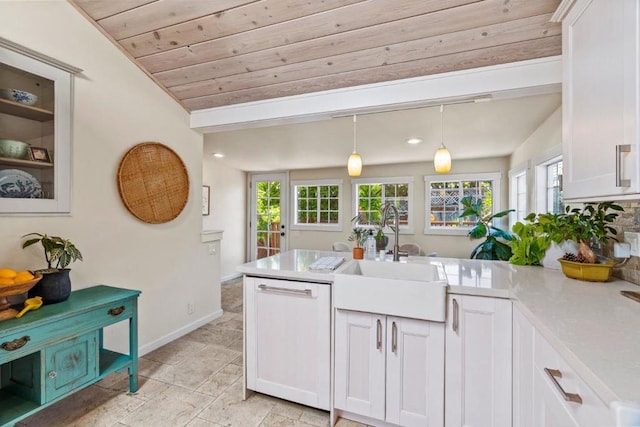 kitchen featuring white dishwasher, white cabinetry, and wooden ceiling