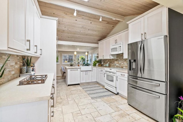 kitchen with white appliances, kitchen peninsula, rail lighting, white cabinets, and wooden ceiling