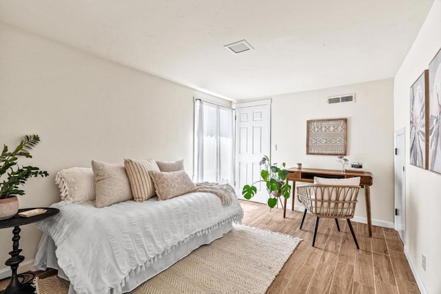 bedroom with light hardwood / wood-style flooring