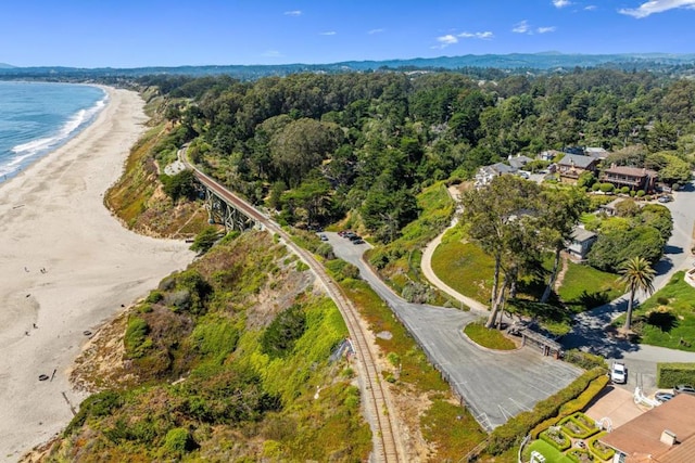 birds eye view of property featuring a view of the beach and a water view