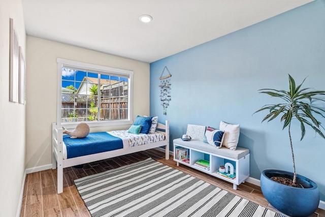 bedroom with wood-type flooring