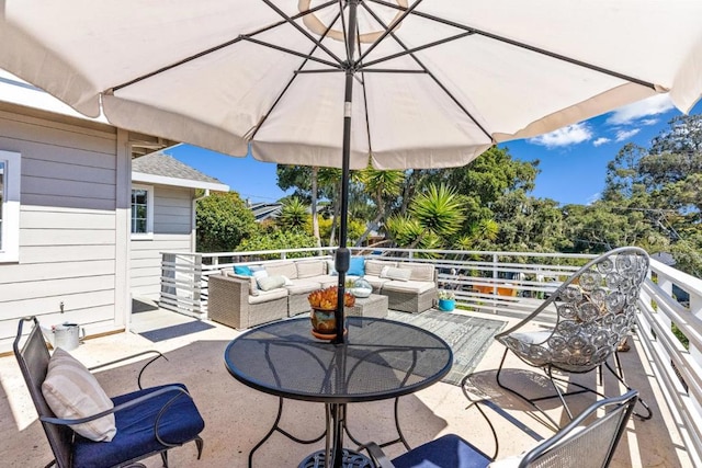 view of patio with a balcony and an outdoor living space