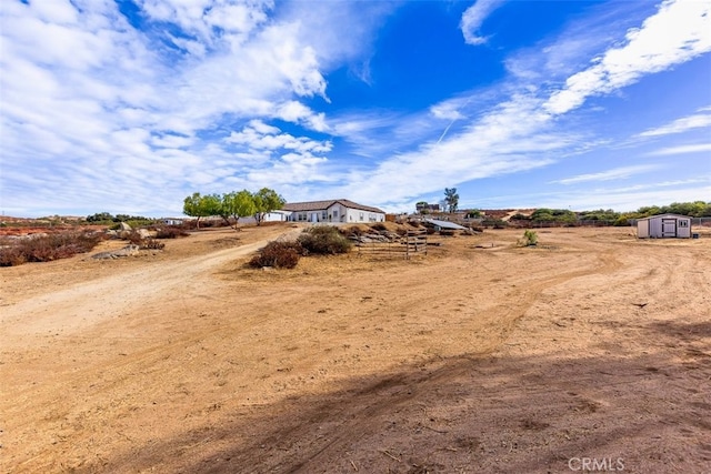 38752 Ruth Rd, Hemet, CA 92544 - view of yard featuring a shed, an outbuilding, and a view of countryside