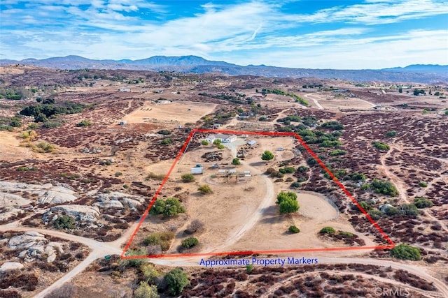 38752 Ruth Rd, Hemet, CA 92544 - overview of rural landscape with property boundaries highlighted, a mountainous background, and a desert landscape