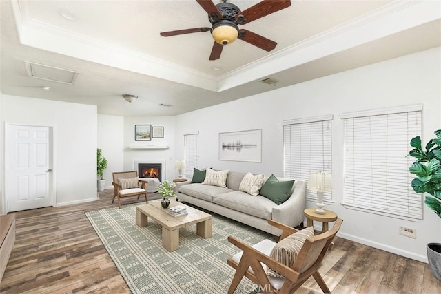 38752 Ruth Rd, Hemet, CA 92544 - living area with a tray ceiling, wood finished floors, ornamental molding, baseboards, and a ceiling fan