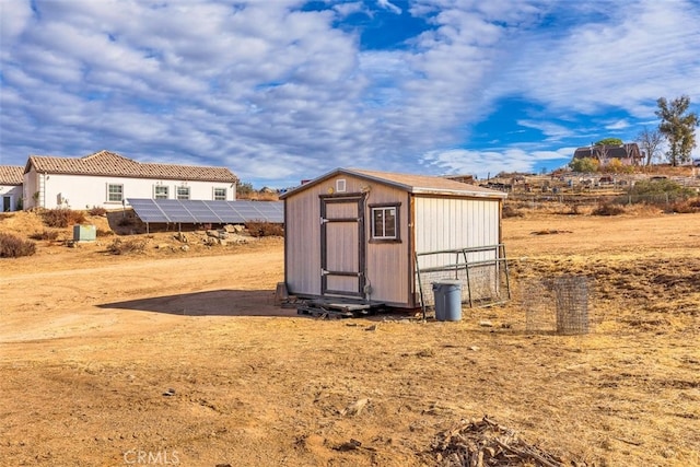 view of shed with solar panels