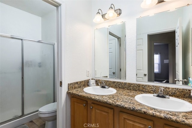 38752 Ruth Rd, Hemet, CA 92544 - full bath featuring a stall shower, toilet, and double vanity