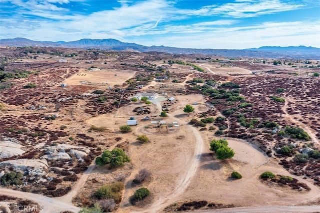 aerial view featuring view of desert and a mountain view