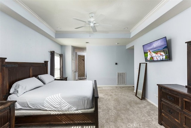 bedroom with crown molding, a raised ceiling, visible vents, light carpet, and baseboards