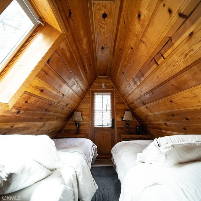 bedroom with wooden ceiling, lofted ceiling, and wood walls