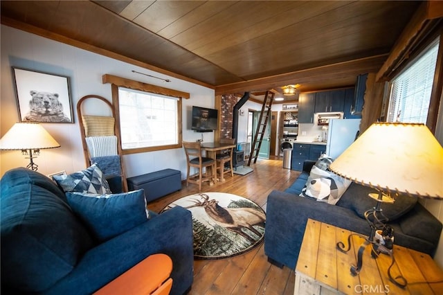 living room with wood ceiling, a healthy amount of sunlight, and hardwood / wood-style flooring