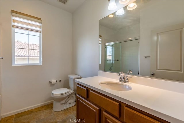 bathroom with tile patterned floors, toilet, walk in shower, and vanity