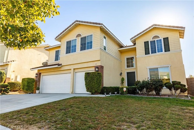 view of front property with a garage and a front lawn